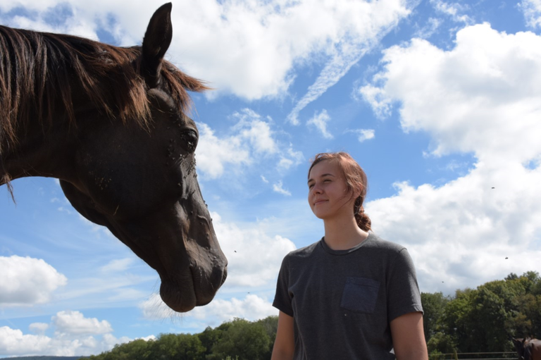 Paulina Oleinik, a senior in Penn State's College of Agricultural Sciences, is one of the live-in employees at the Penn State Horse Barn. IMAGE: PENN STATE