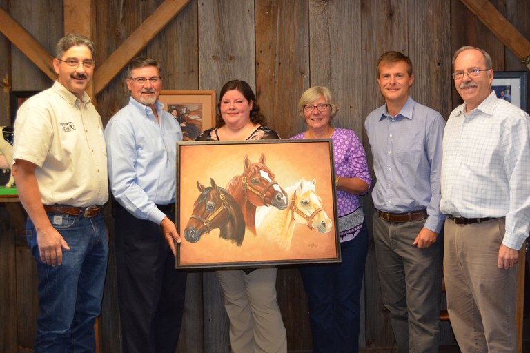 Painting of Penn State stallions on display in Penn State's Department of Animal Science. From left: Brian Egan, Joe Tylka, Artist Caitlin Walsh, Julianne Tylka, Burt Staniar and Terry Etherton.