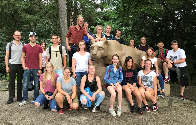 The visiting Swiss students enjoyed the opportunity to pose with the Nittany Lion.