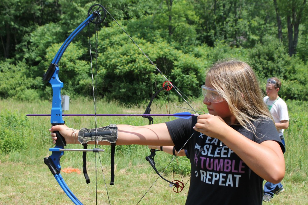 Northwinds 4-H Camp A camper is participating in an archery workshop during Northwinds 4-H Camp