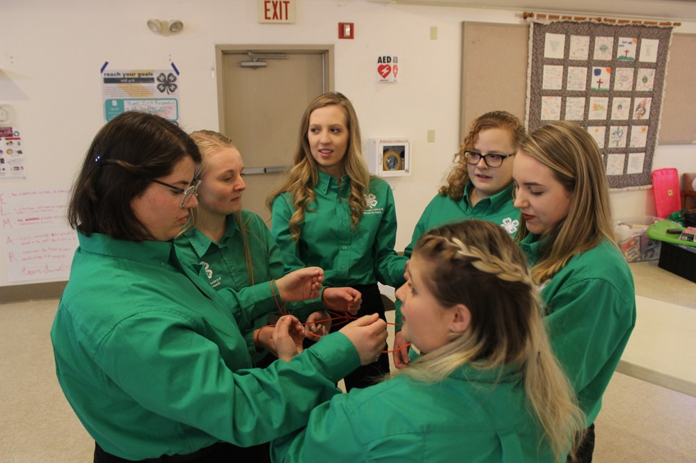 State Council April Reports State Council participates in a teambuilding exercise during their February training.